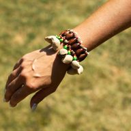 Shaker à main en coquille Kenari - Bracelet à grelots (15 pièces)