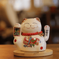 Chat porte-bonheur solaire sur socle en bois – Patte rose mobile